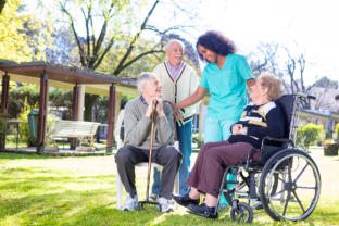 certified nurse assisting a senior woman