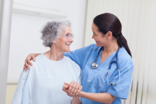 licensed practical nurse assisting a senior woman