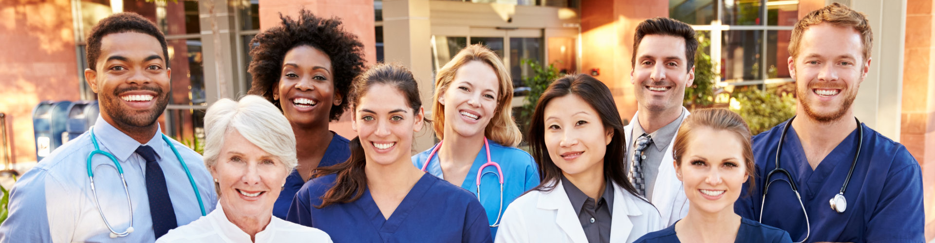 Group of medical professionals smiling in front of camera