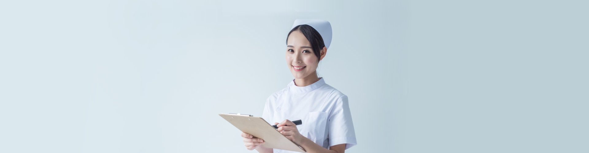 certified nurse holding a pen and checklist notebook